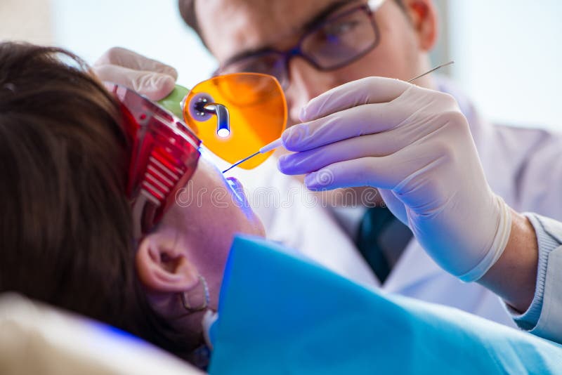 The Patient Visiting Dentist for Regular Checkup and Filling Stock
