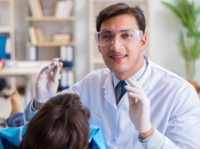 Patient Visiting Dentist for Regular Checkup and Filling Stock Photo