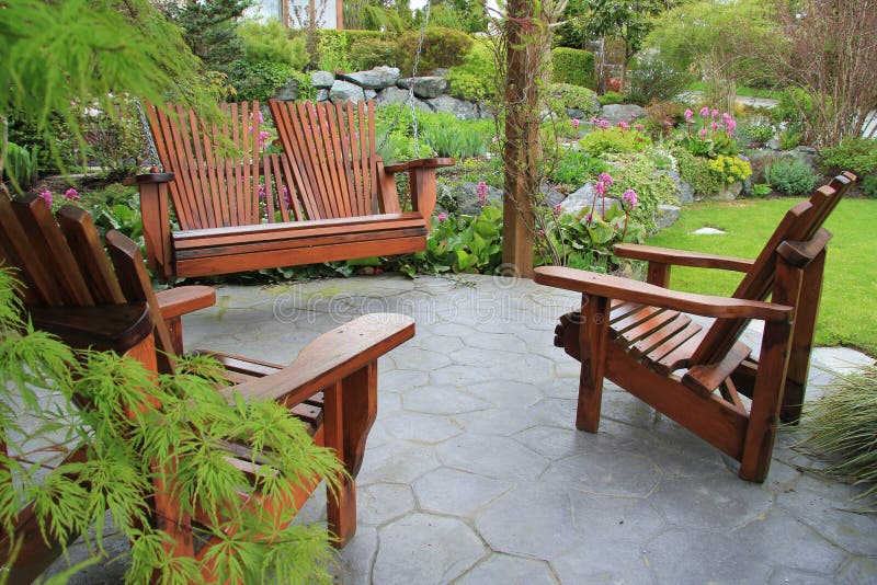 Patio furniture in the garden. royalty free stock photography