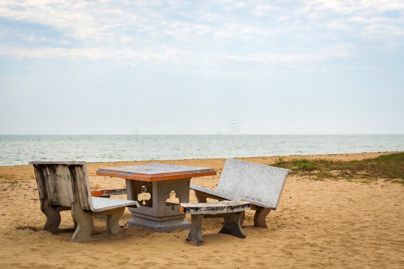 Patio with Stone Furniture, Chairs and Table on Sandy Beach Stock Image