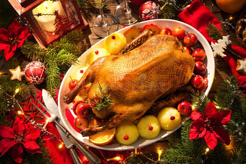 Christmas roast duck served on a festive table. Christmas roast duck served on a festive table