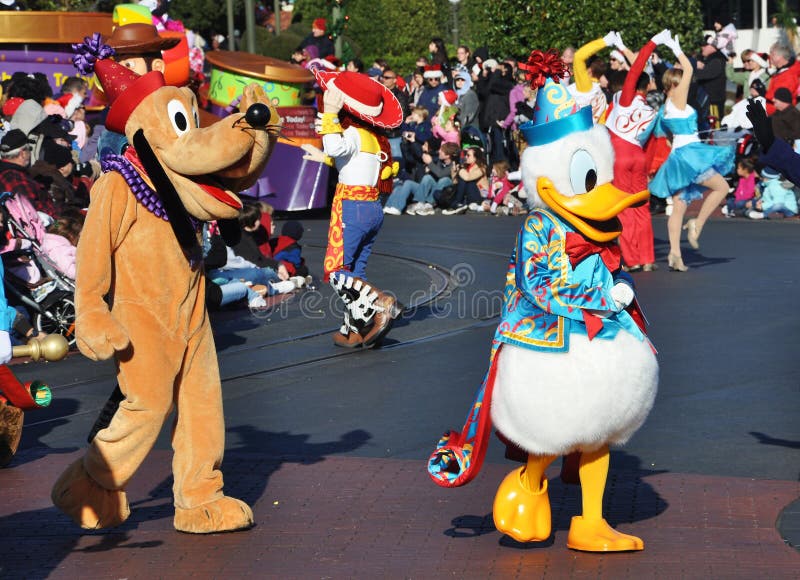 Donald Duck and Pluto in A Dream Come True Celebrate Parade in Disney World Orlando, Florida, USA. Donald Duck and Pluto in A Dream Come True Celebrate Parade in Disney World Orlando, Florida, USA