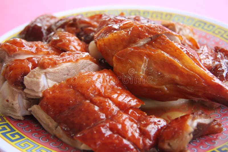 Roast duck chinese cuisine sliced portions on plate. Roast duck chinese cuisine sliced portions on plate