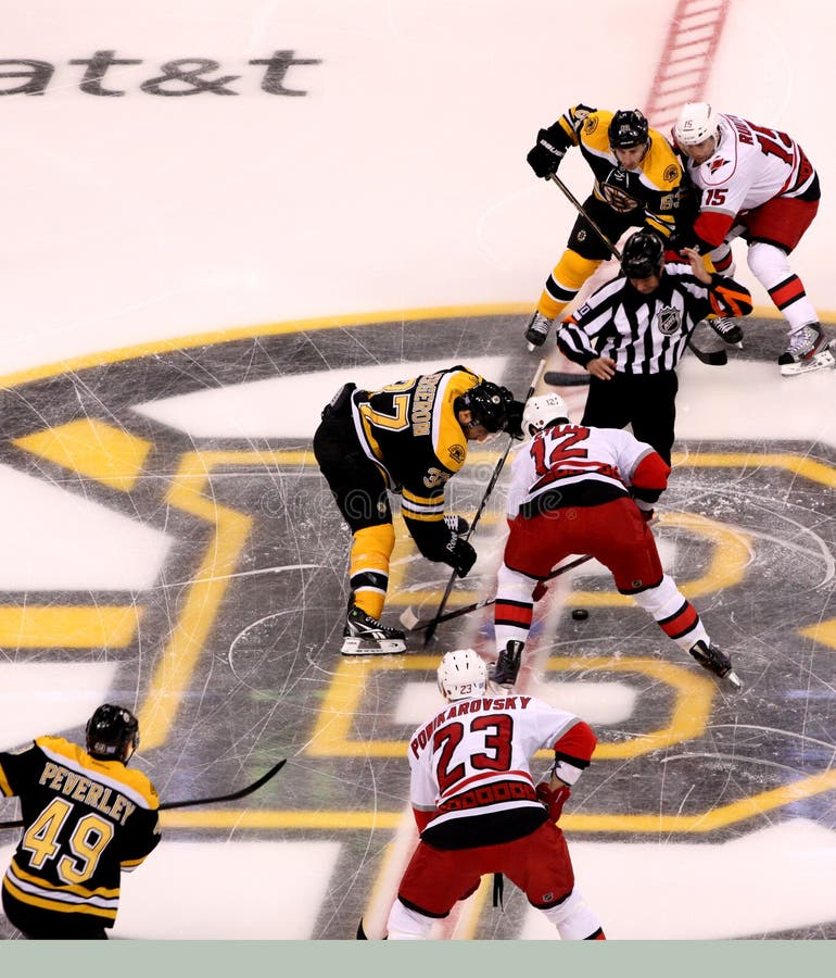 Patrice Bergeron and Eric Staal opening faceoff.