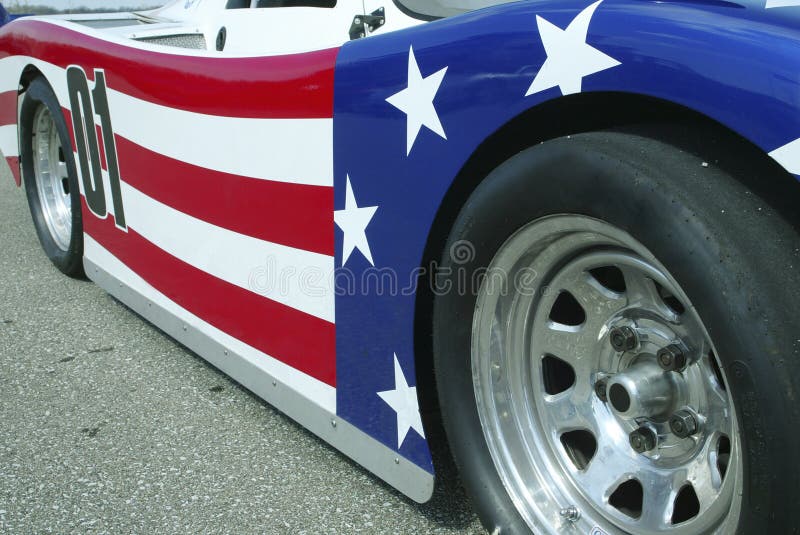 Detailed view of the side of a race car painted in stars and stripes. Detailed view of the side of a race car painted in stars and stripes