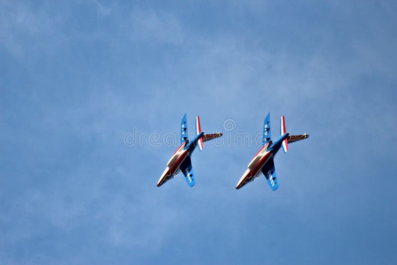 Patrouille de France airshow French army military. Patrouille de France airshow French military air force French republic alpha jet acrobatic figures airplane