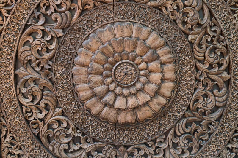 Pattern of flower carved on wood background