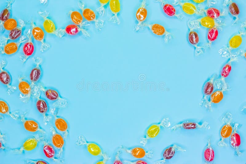 Pattern lollipops, candy on colorful white frame background, top view flat lay. stock image Pattern lollipops, candy on colorful white frame background, top view flat lay. stock image