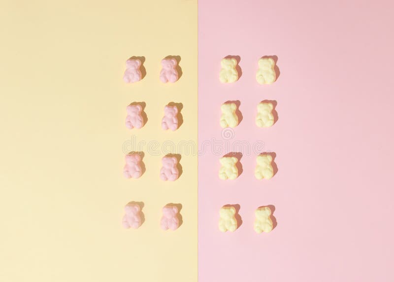 Pattern of Marshmallow Candy Bears on a Pinkyellow Background. Minimal