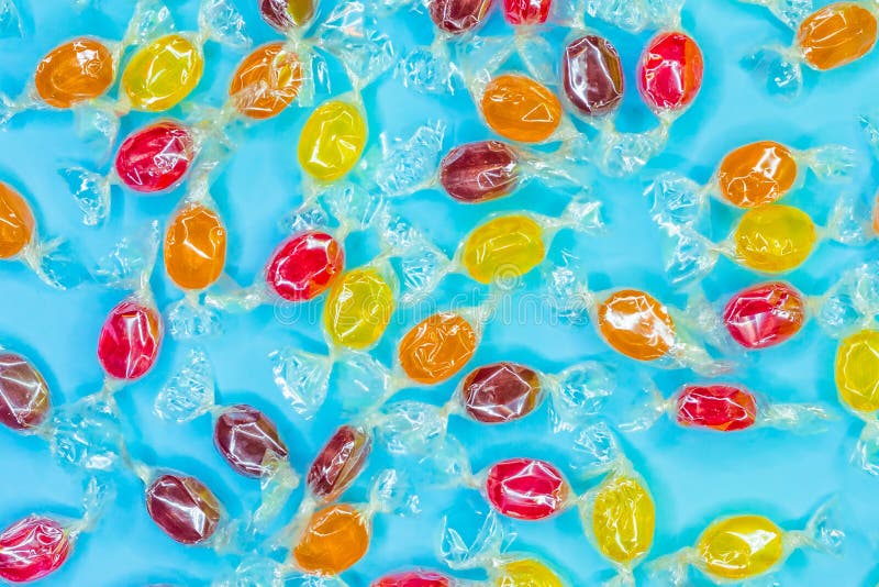 Pattern of a variety of multi-colored candy on a blue background royalty free stock photo Pattern of a variety of multi-colored candy on a blue background royalty free stock photo