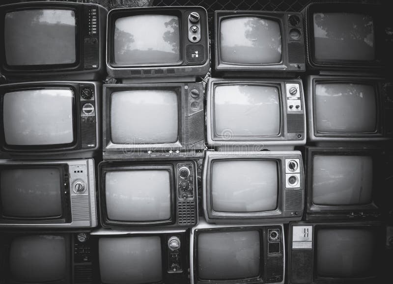 Pattern wall of pile black and white retro television TV - vintage filter effect style.