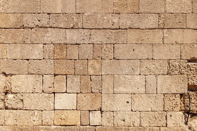 Pattern of Yellow Block from Old Architecture Castle Wall Stock Photo