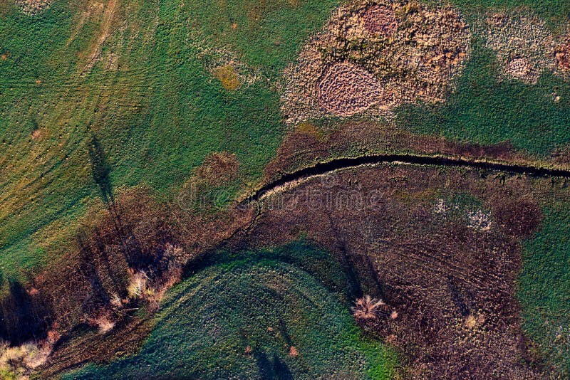 Patterns in the farmland fields at spring stock images