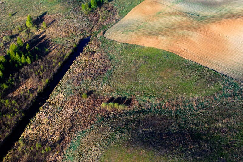 Patterns in the farmland fields at spring stock photography