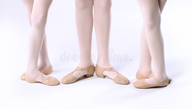 Three Isolated Young Girls Wearing Dance Shoes. Three Isolated Young Girls Wearing Dance Shoes