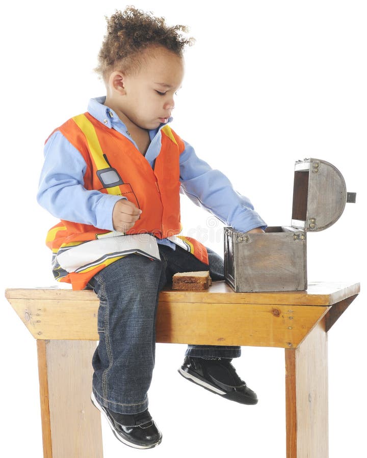 An adorable preschooler construction worker having lunch on an old benh. On a white background. An adorable preschooler construction worker having lunch on an old benh. On a white background.