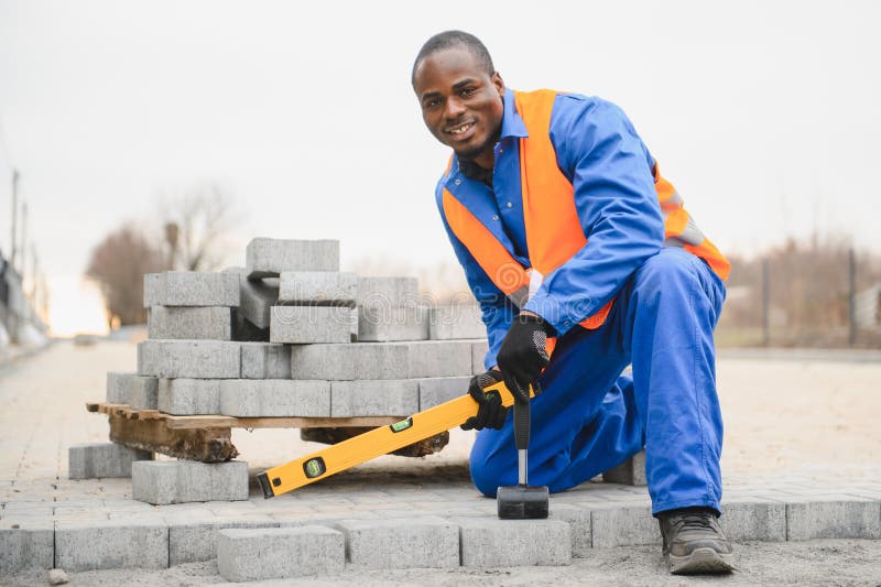 Pavement. Laying paving stones. Cube, openwork plate royalty free stock images