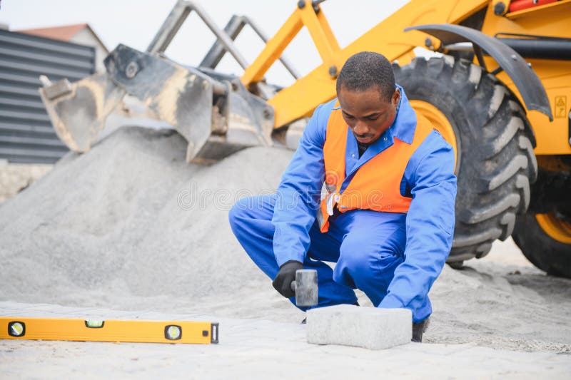 Pavement. Laying paving stones. Cube, openwork plate royalty free stock image