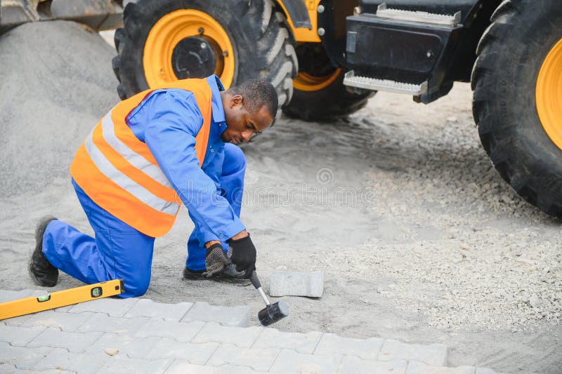 Pavement. Laying paving stones. Cube, openwork plate royalty free stock images