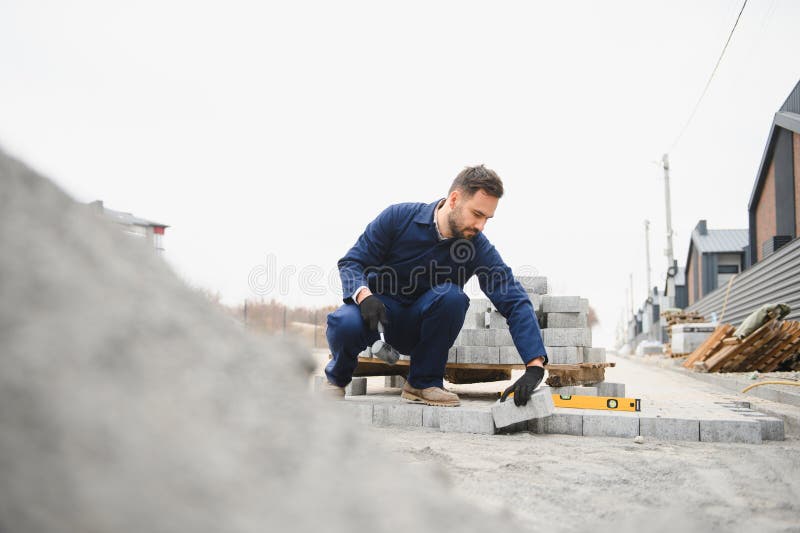 Pavement. Laying paving stones. Cube, openwork plate