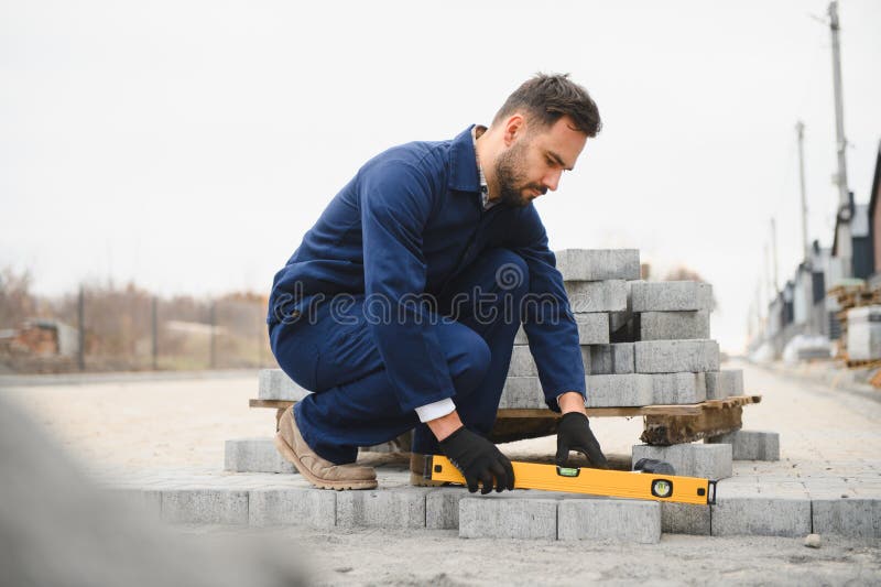 Pavement. Laying paving stones. Cube, openwork plate royalty free stock image