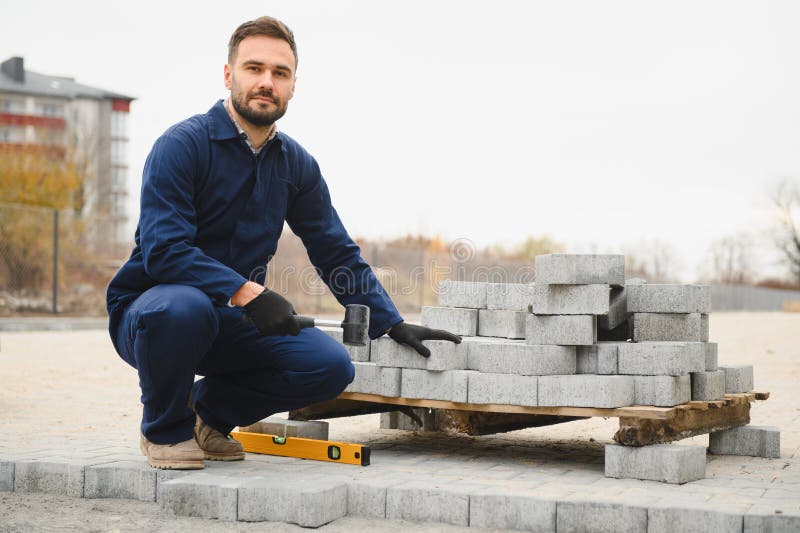 Pavement. Laying paving stones. Cube, openwork plate stock image