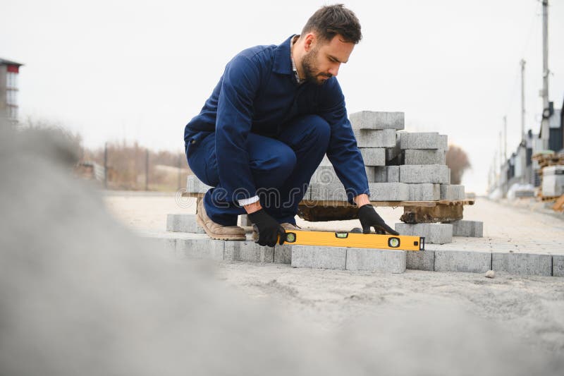 Pavement. Laying paving stones. Cube, openwork plate royalty free stock photo