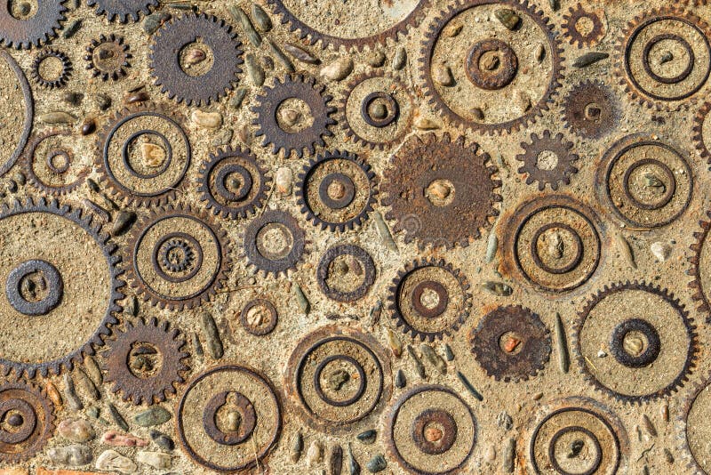 Pavement texture with gears and bricks in Montjuic, Barcelona, Spain.