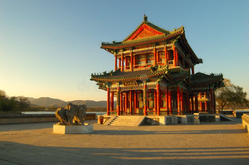 The setting sun gives a warm color to the pavilion in the winter, The Summer Palace, Beijing, China. The setting sun gives a warm color to the pavilion in the winter, The Summer Palace, Beijing, China