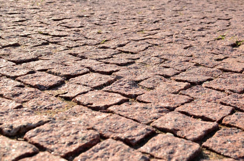 Paving blocks made of asymmetrical stone. royalty free stock photos