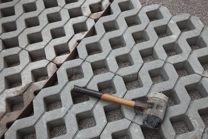 Paving blocks and mallet stock image