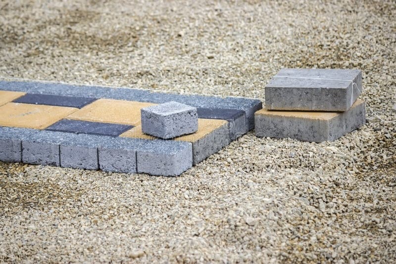 Paving stones for sidewalk on a construction site. Selective focus and shallow dof. Bricklayer tiler stock images, royalty-free photos and pictures