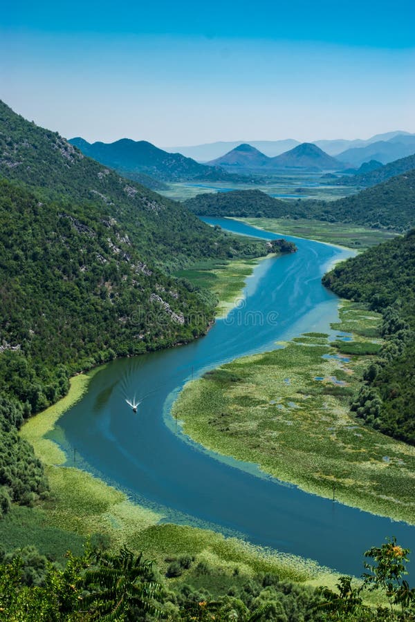 Pavlova Strana View Point. Beautiful summer landscape of green mountains, blue sky and Crnojevica river that flows into Skadar