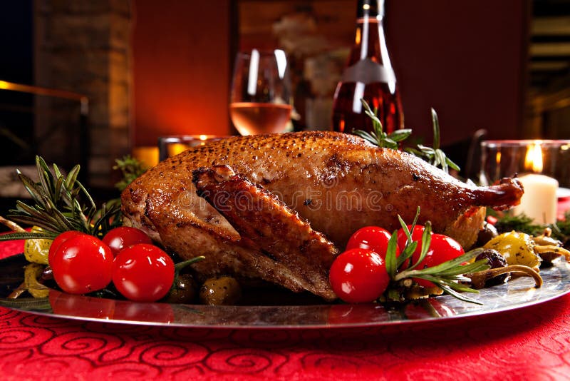 Christmas roast duck served on a festive table. Christmas roast duck served on a festive table