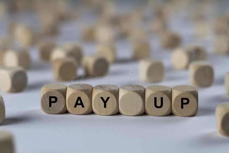 Pay up - cube with letters, sign with wooden cubes royalty free stock photography