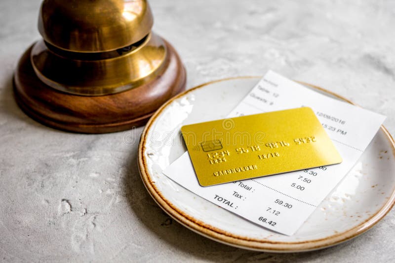 Paying Check for Lunch in Cafe with Credit Card on Stone Table