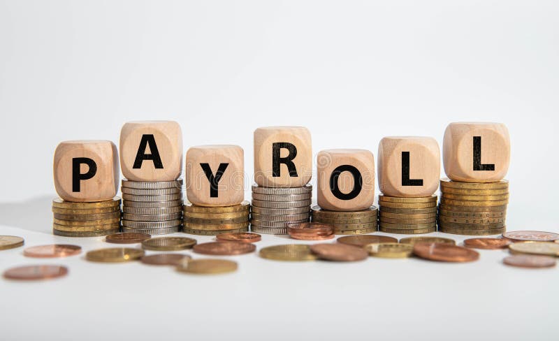 PAYROLL symbol. Copy space. Concept word PAYROLL on wooden blocks stock photos