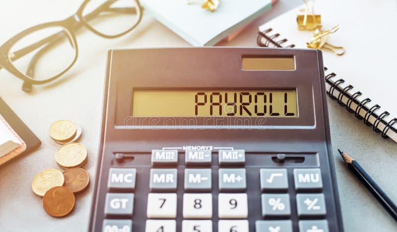 Payroll word written on calculator. Business and financial concept royalty free stock photos
