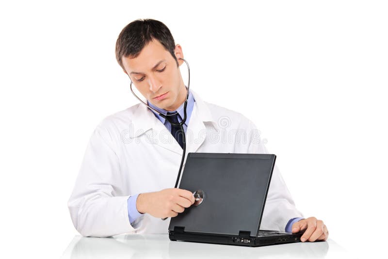 PC doctor examining a laptop computer against white background. Laptop personal computer stock images, royalty-free photos and pictures