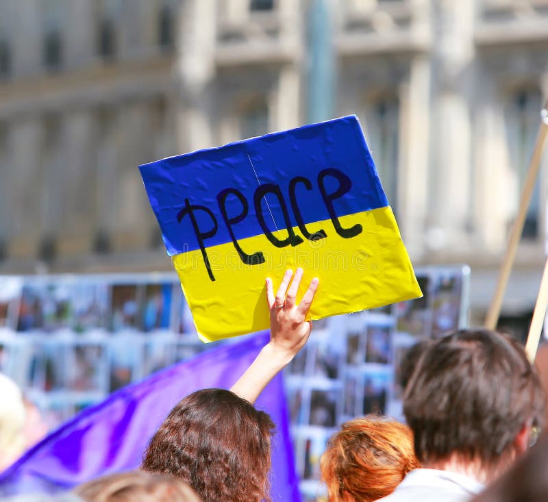 Peace sign on the ukrainian flag in protest manifestation against war in Ukraine