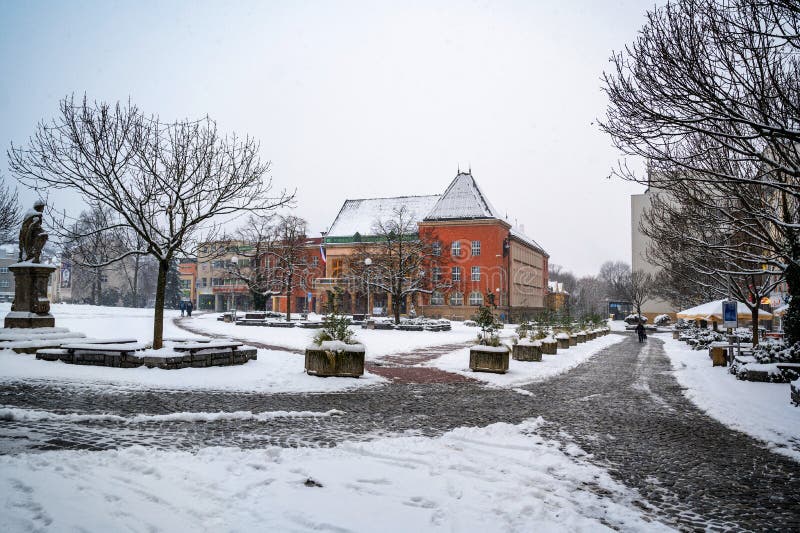 Peace square with red building of town hall in fresh snowing, Zlin