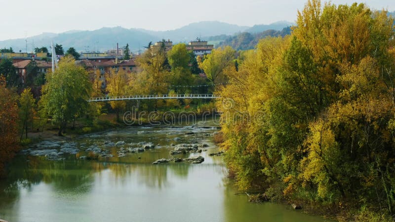 Peaceful autumn river city tranquil landscape fall footbridge reno river Bologna - Casalecchio di Reno - Italy