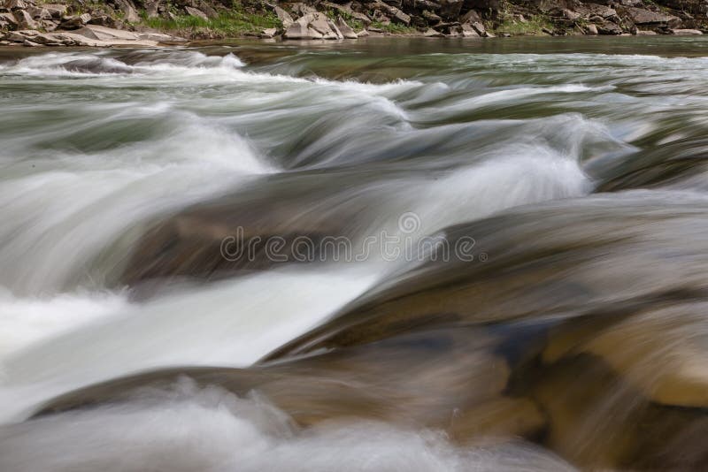 Peaceful flowing stream in mountains