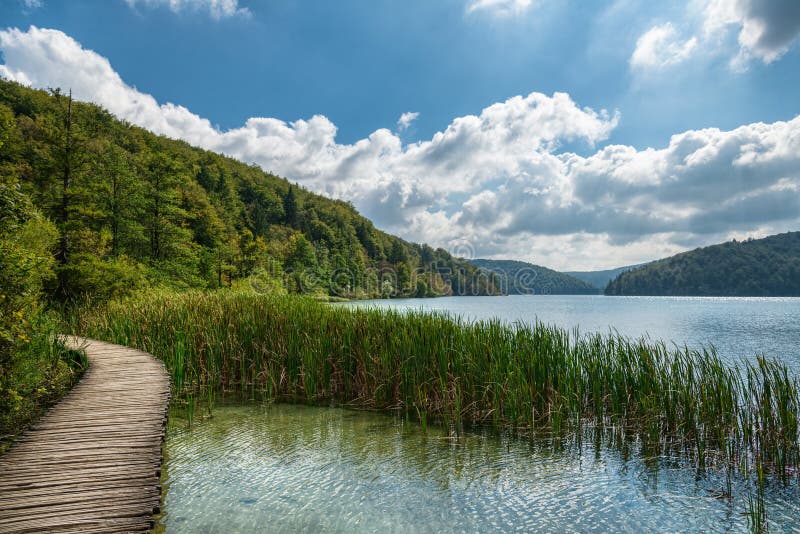 Peaceful landscape with path around lake stock image