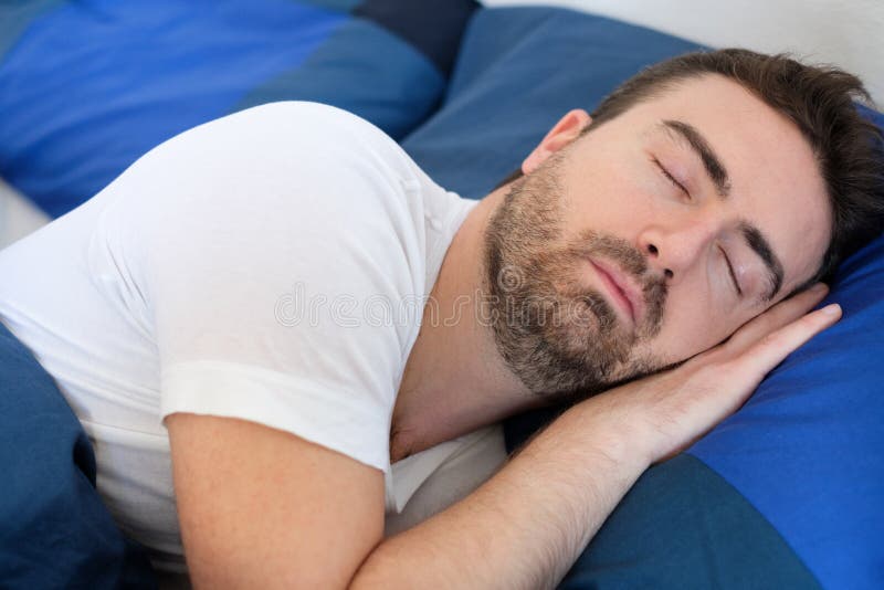 Peaceful Man Sleeping Under Covers in Bed Stock Photo Image of face
