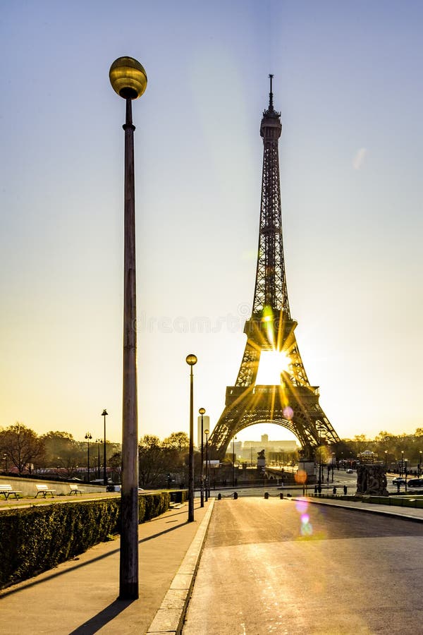 Peaceful sidewalk and sunrise over Paris