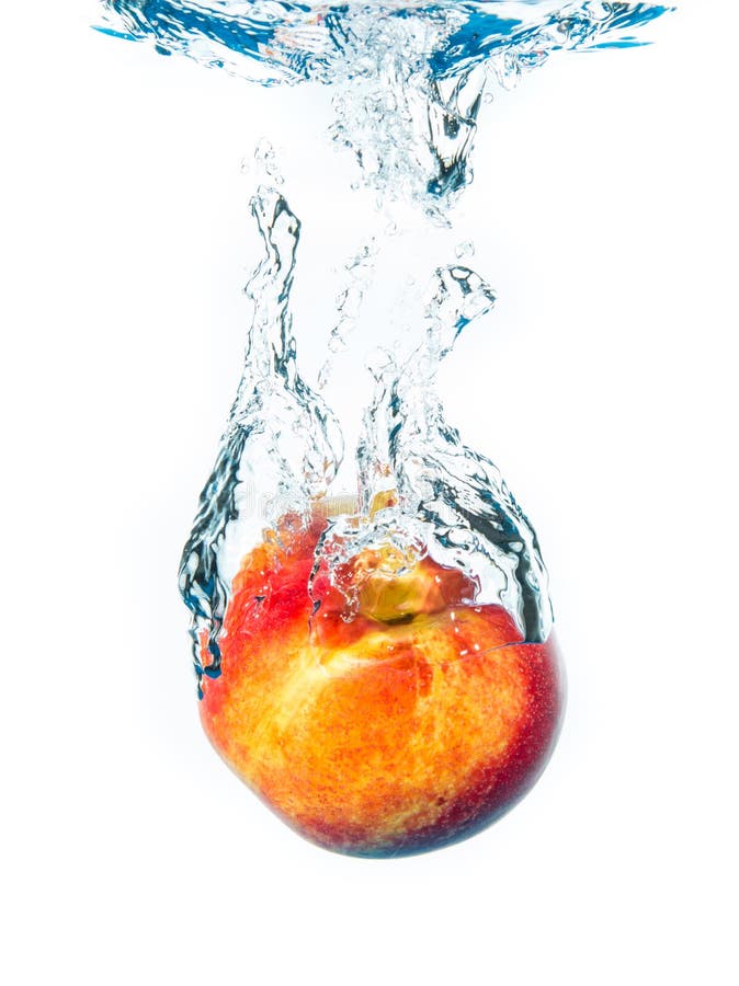 Peach splashing in water stock image. Image of section 15544723