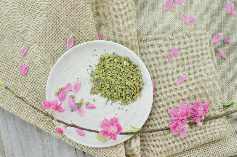 Peach flower and white plate with rice tea royalty free stock photography Peach flower and white plate with rice tea royalty free stock photography