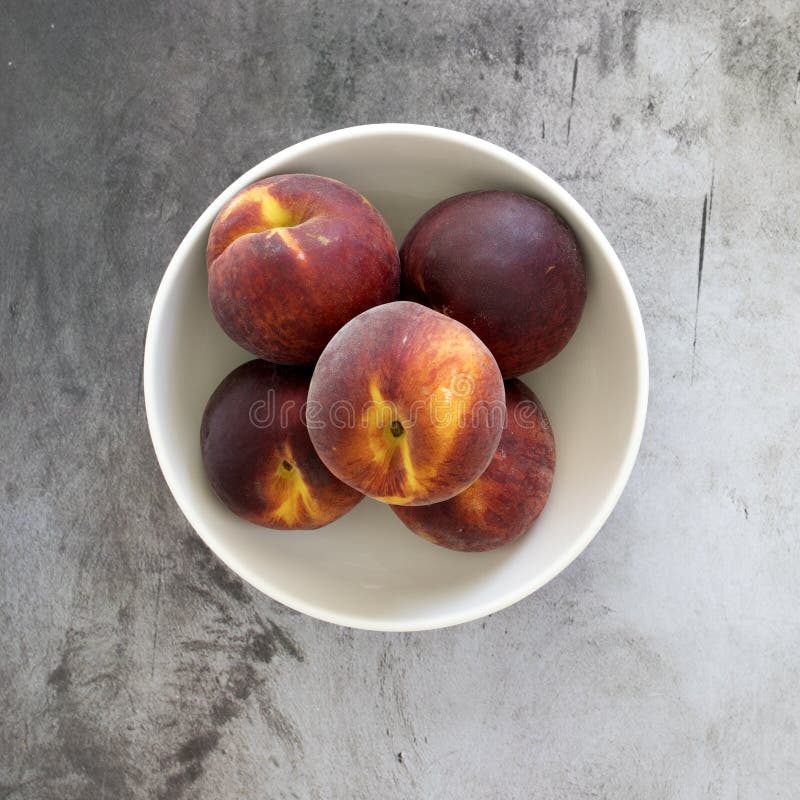 Peaches in a Bowl stock photo. Image of concrete, bowl 186272168