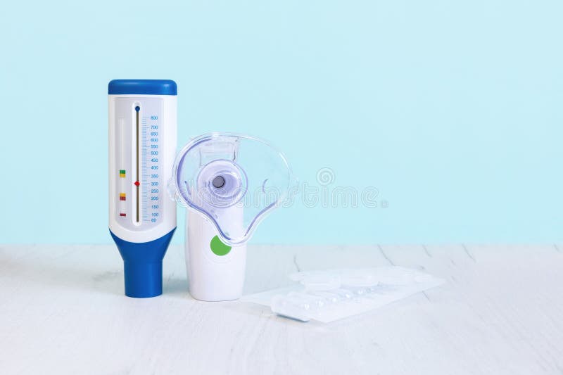 Peak flow meter, mesh nebulizer and nebulas. Copy spase stock photography